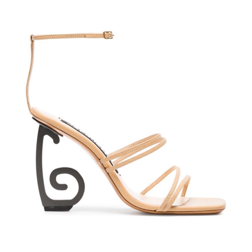 Geometric sandals by Jacquemus.